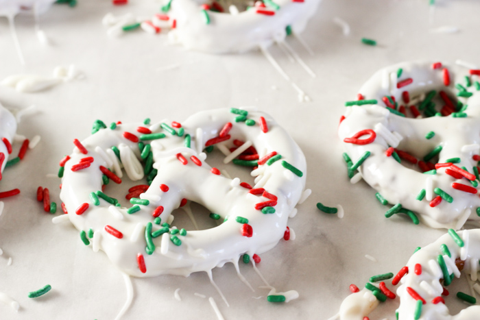 chocolate covered pretzels with Christmas sprinkles