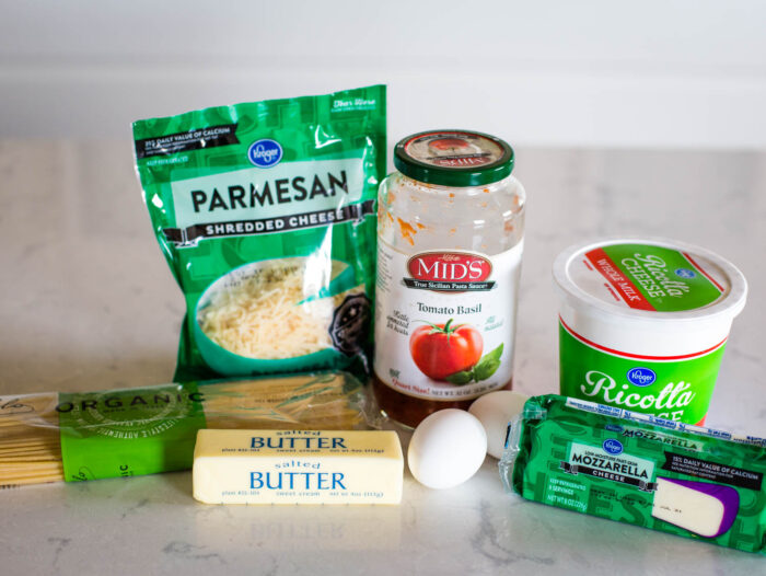 ingredients to make spaghetti pie together on counter top in kitchen