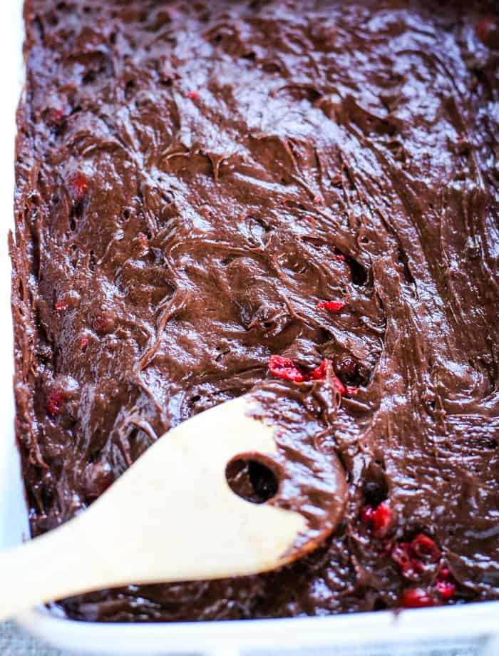 chocolate cake with cherry in pan before baking