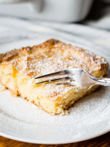 gooey butter cake on plate with fork