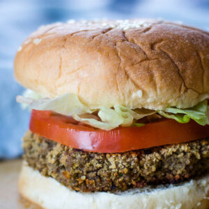 black bean burger on bun with tomato and lettuce
