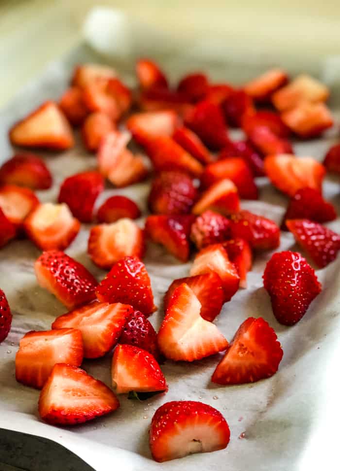frozen fresh strawberries on parchment paper