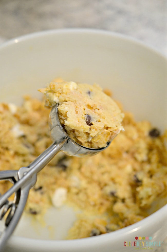 Scooping cookie dough for cornflake cookies