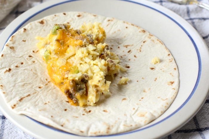 crockpot breakfast on tortilla on plate