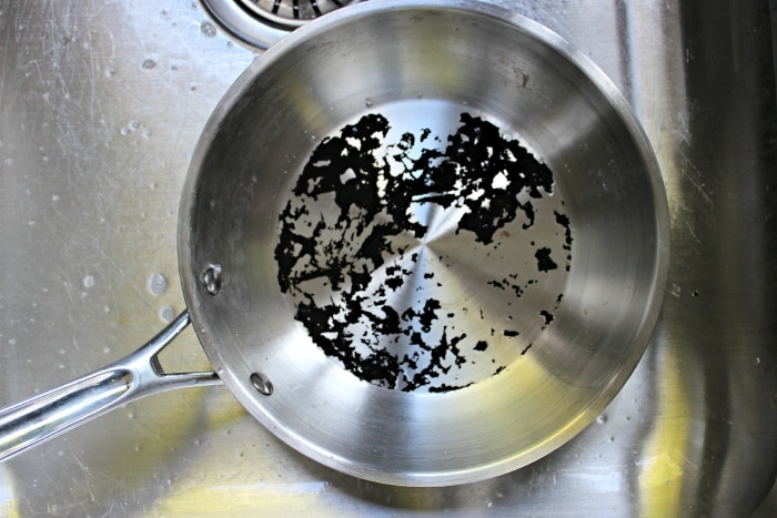 cleaning the pan that is burnt