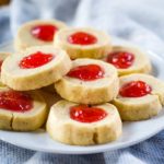 plate of almond thumbprint cookies