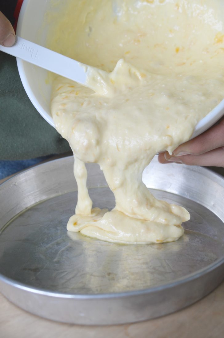 placing batter into pan before baking