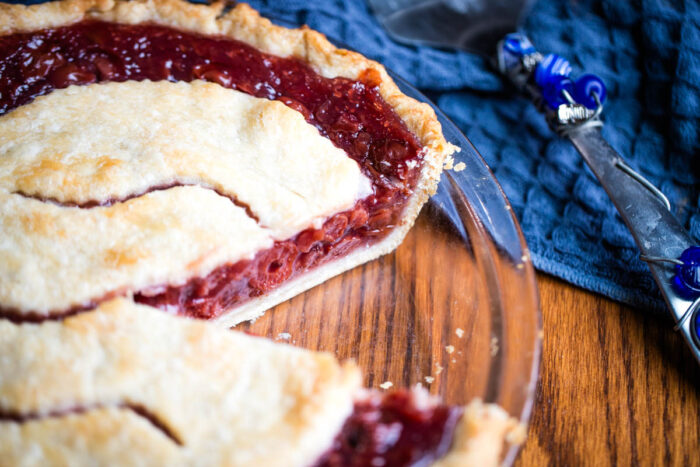 cherry pie with slice removed showing filling