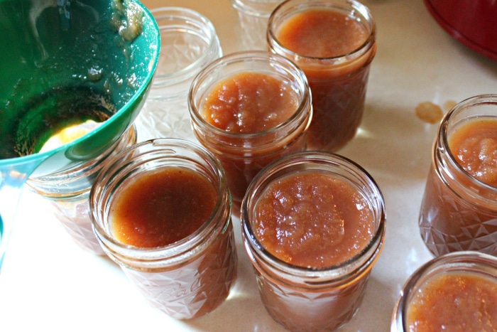 applesauce apple butter in a crockpot in canning jars