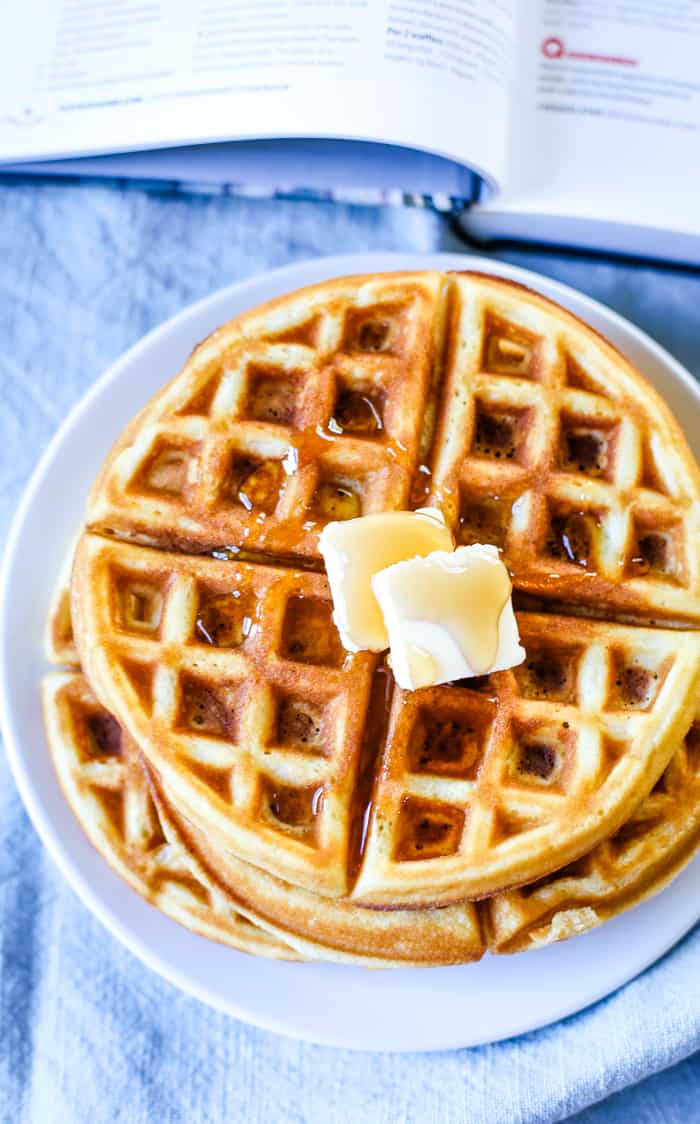 waffles on plate with pat of butter on top