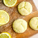 lemon cookies on board with slices of lemon