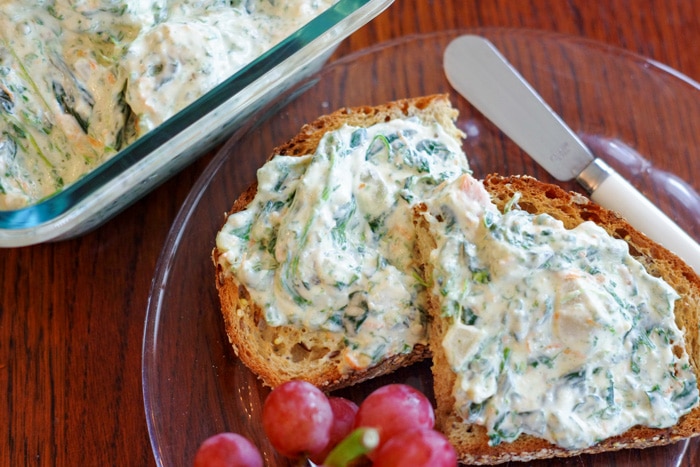 cold spinach dip on toast with a side of grapes