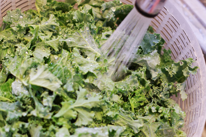 washing kale in a salad spinner