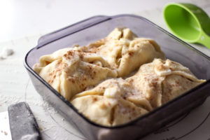 apple dumplings in pan before baking