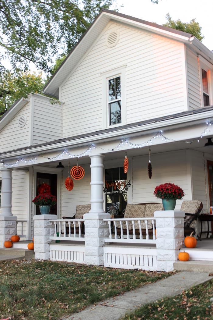 white farmhouse porch with halloween fall decorations