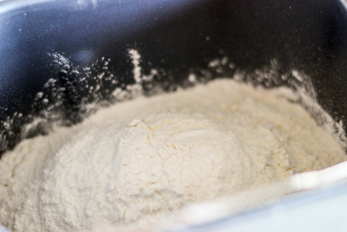 flour and ingredients in bread machine pan