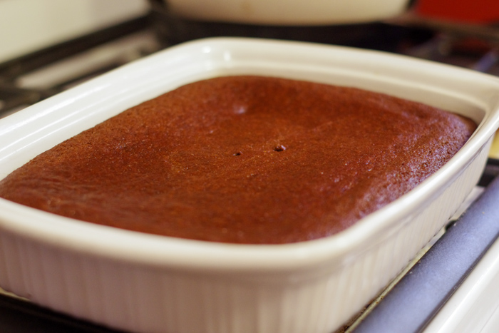 molasses cake in pan on top of oven