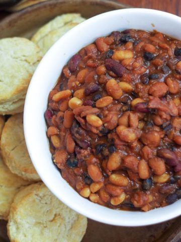 baked beans in bowl with side of biscuits
