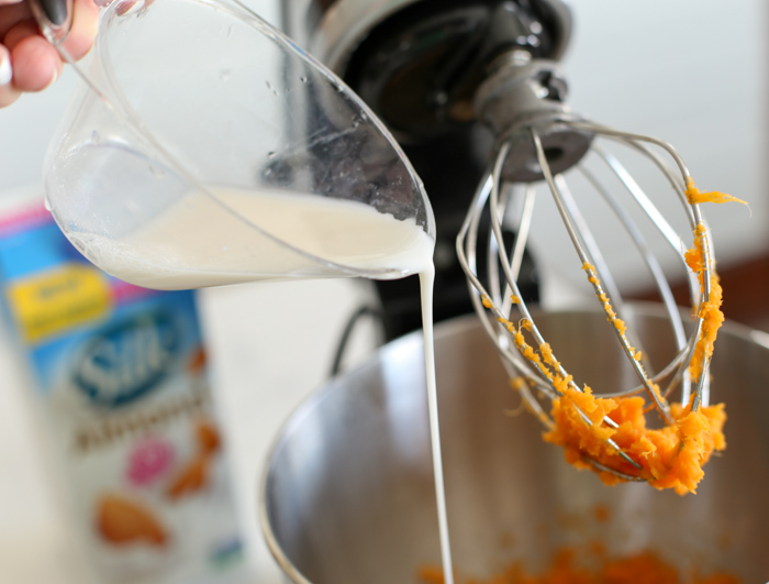 mixing bow with dairy free almondmilk for sweet potato muffins