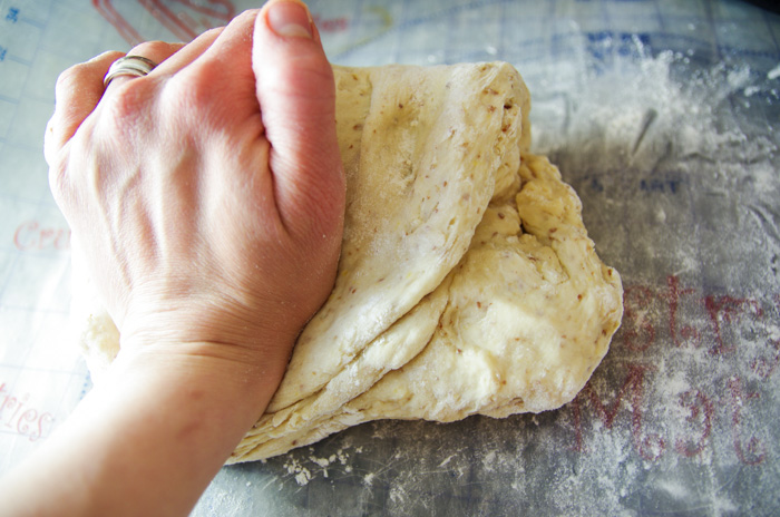 kneading vegan cinnamon roll dough