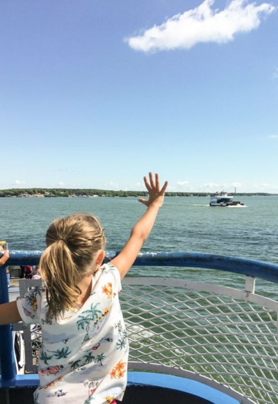 girl waving to miller ferry