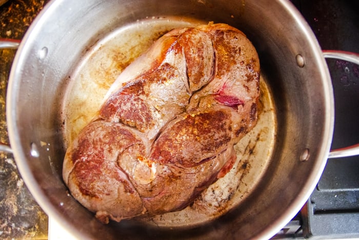venison roast in stockpot browning