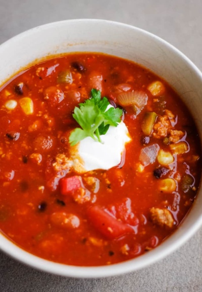 healthy turkey chili in bowl with sour cream
