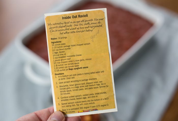 inside out ravioli casserole recipe card in hand