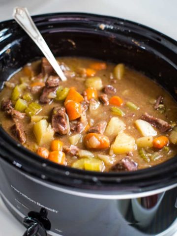 slow cooker beef stew with spoon