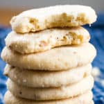 pecan sandies cookies stacked on cloth