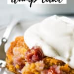 cherry pineapple dump cake on plate with fork