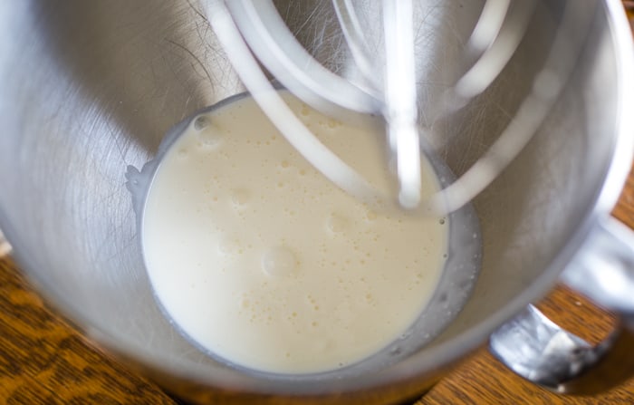 heaving whipping cream in chilled mixer bowl