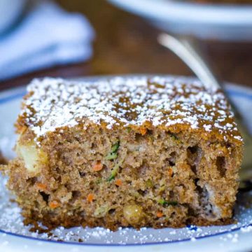 zucchini cake on plate with fork
