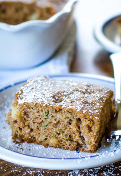 zucchini cake slice on plate with fork