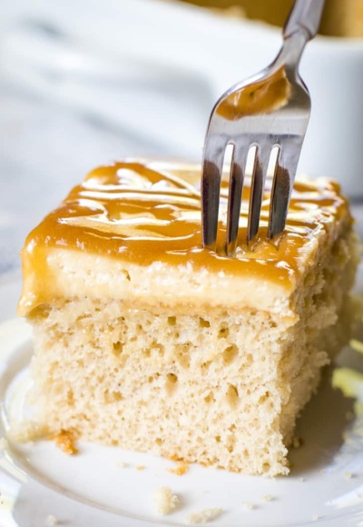 caramel cake with fork on white plate