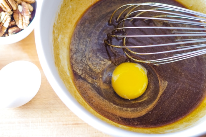 whisked eggs into chocolate in bowl
