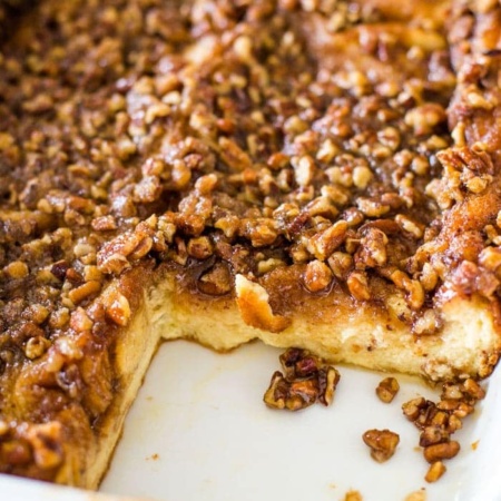 baked french toast casserole in pan with slice taken out