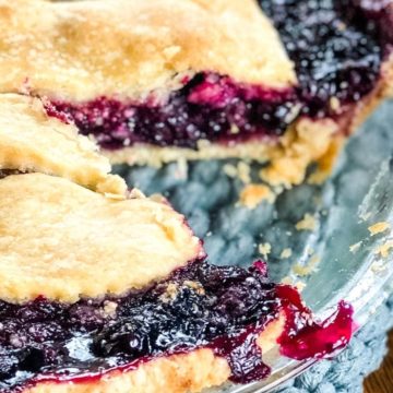 slice out of blueberry pie with thick pie filling