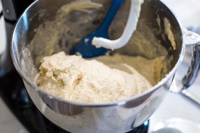 homemade bread dough in mixer with dough hook