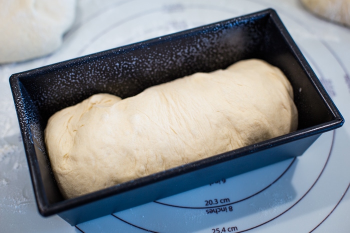 bread dough in baking pan
