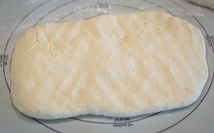 bread dough pressed into rectangle