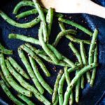 fresh green beans sauteed with wooden spoon
