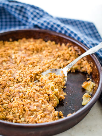 apple crisp with spoon on table
