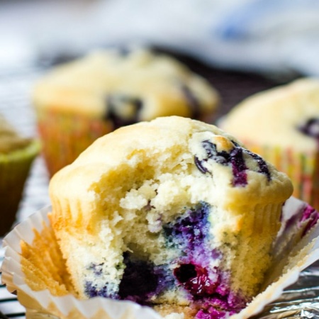 close up of blueberry muffin with bite out of it