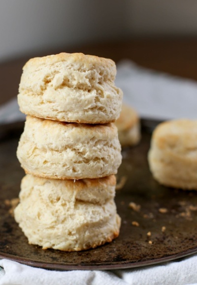 stack of homemade biscuits on baking pan