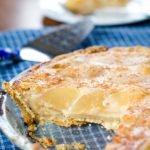 custard pear pie with slice out of it
