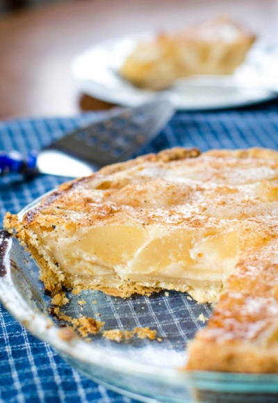 custard pear pie with slice out of it