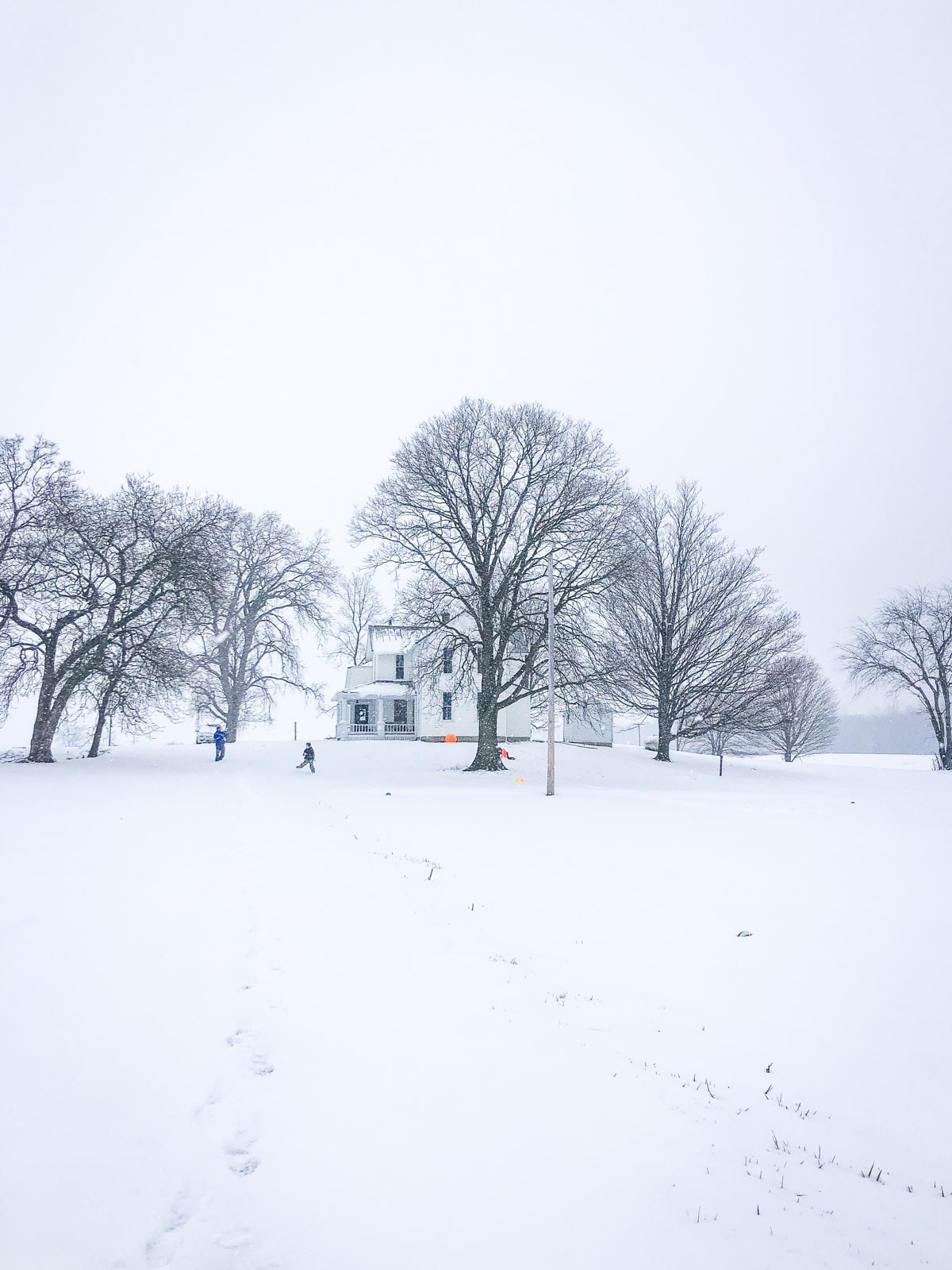 farmhouse with snow