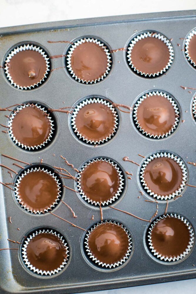 top layer of chocolate added to peanut butter cups