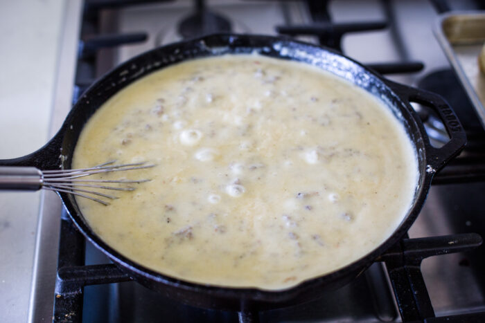 sausage gravy simmering on cast iron